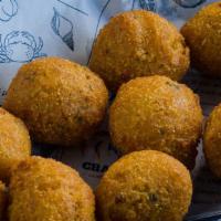 Hush Puppies (10) · Corn meal batter, garlic powder, served with  butter sauce