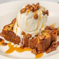 Georgia Peach Pound Cake · Griddled in butter with scoop of vanilla bean ice cream, Bourbon caramel sauce & spiced peca...