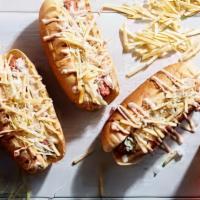 3 Mini Hot Dogs  · Venezuelan style onions, cabbage, cilantro sauce, mustard, ketchup, potato stick, cheddar ch...