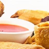 Pu Pu Platter · Two chicken wings, two bbq spare ribs, two cheese wontons, two spring egg rolls, two egg rol...