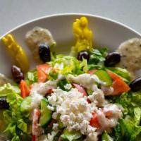 Greek Salad With Chicken · Includes lettuce, tomatoe, onions, peppers, purple cabbage, feta cheese and chicken shawarma...