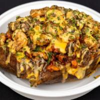 Biggie Potato · Baked potato stuffed with BBQ chicken, ribeye -steak, shrimp, broccoli, topped with cheddar ...