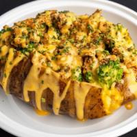 Outkast · Baked potato stuffed with seasoned chicken, & broccoli topped with cheddar cheese, sour crea...