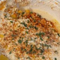 Elote · Shaved corn in creamy mayo sauce with cotija cheese and cayenne pepper