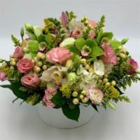 Garden Blooms · A mixed and elegant bouquet designed with delicate flowers as Lisianthus blooming over white...