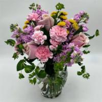 Spring Garden · A spring bouquet with soft colors in a clear vase.