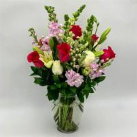 Smiles · Colorful and bright , this bouquet with hot pink and white roses, light purple stocks and li...