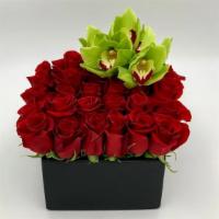 Simple Red · Square ceramic vase with twenty-five red roses and a touch of white cymbidiums.