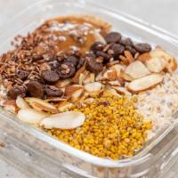 Almond Overnight Oats · Rolled oats, honey chia seeds, almond milk, vanilla extract, cacao nibs, almond butter, bee ...