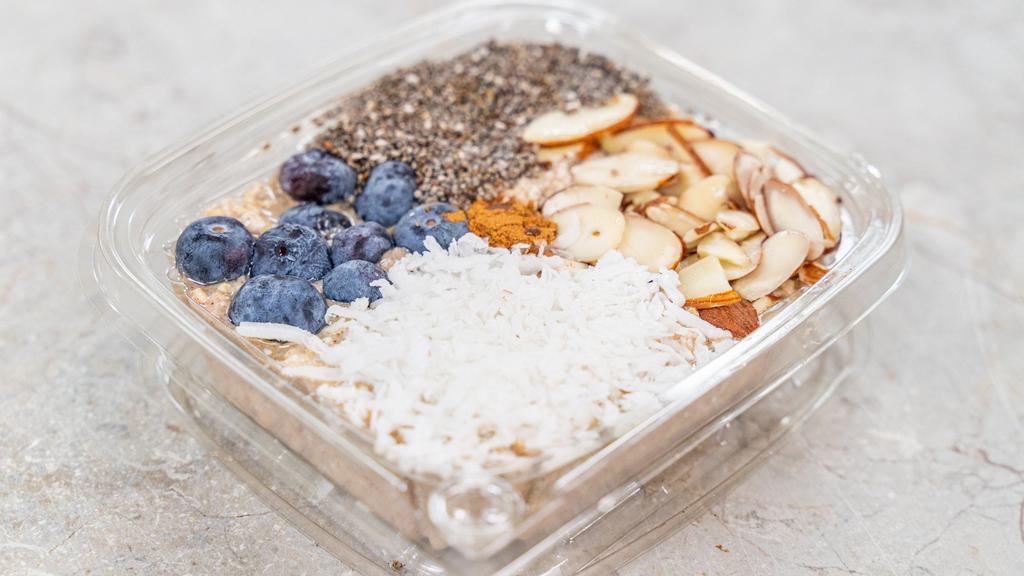 Cinna Coconut Overnite Oats · Rolled oats, nutmeg, cinnamon, almond milk, blueberries, flaxseed, coconut and almonds.