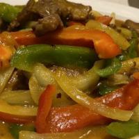 Beef Curry · Mild spicy. Beef sautéed with green pepper, carrot and onion in spicy yellow curry sauce.