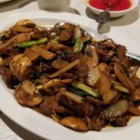 Mongolian Beef · Sliced beef sautéed with scallion, bamboo shoot, onion and mushroom.