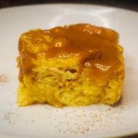 Bread Pudding · Baked French bread infused with milk, cinnamon, allspice, and cloves topped with a vanilla g...