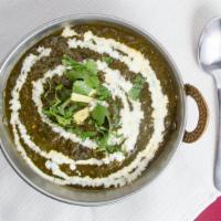 Palak Paneer · Creamed spinach cooked delicately with cheese cubes.