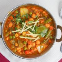 Mixed Vegetables  Curry · Fresh vegetables blended with spiced with a touch of curry sauce.