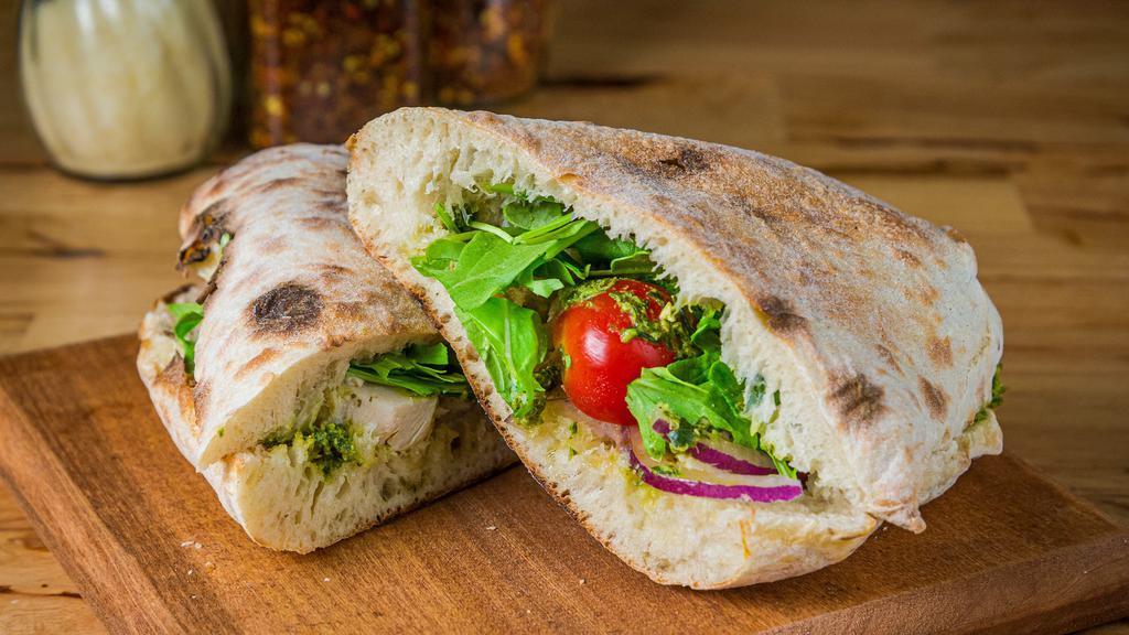 Chicken Pesto Sandwich · Chicken, arugula, cherry tomatoes, red onions and pesto