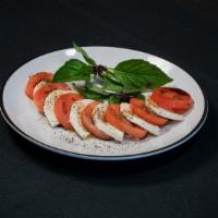 Caprese Salad · Vegetarian. Fresh mozzarella, tomatoes, basil, balsamic vinegar and extra virgin olive.