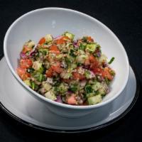 Shirazi Salad · Fresh diced tomatoes, cucumbers, onions, herbs with lemon juice, and Extra virgin olive oil.