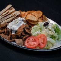 Lamb Gyro Platter · Served with Greek salad, feta cheese, house potato chips, pita bread. And sauce of your choi...