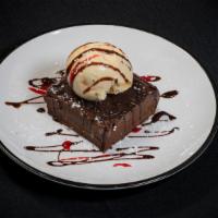 Chocolate Truffle · (Flourless) topped with vanilla ice cream.