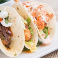 House Trio · Choice of any three house tacos. Served with rice and your choice of beans.