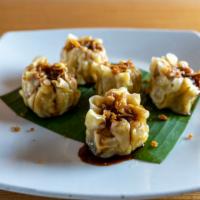 Kanom Jeeb · Homemade steam pork and crab meat dumplings served with deliciously sweet house sauce.