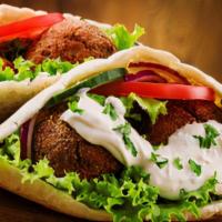 Falafel Sandwich (Vegetarian) · Fried patties made from ground chickpeas and spices served with lettuce, tomatoes, onions, a...