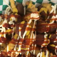 Salchi Papa · French fries with two delicious hotdogs with mayo mustard and Catch up