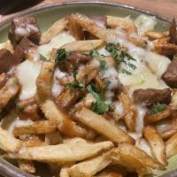 Brisket Poutine · House Smoked Honey-Chipotle, Rubbed Beef Brisket, Cheddar Cheese, Curds, Belgian Frites, and...