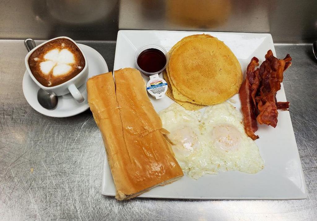 Casavana Breakfast · 2 eggs any style with a choice of ham or bacon, 2 pancakes, toast, and café con leche.