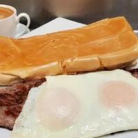 Bistec A Caballo · Marinated steak topped with two fried eggs choice of French fries or Cuban toast and served ...