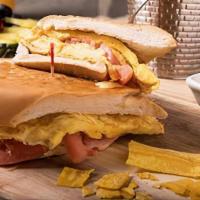 Pan Con Tortilla · Egg omelet with onions and julienne fries, made to order, and on toasted Cuban bread.