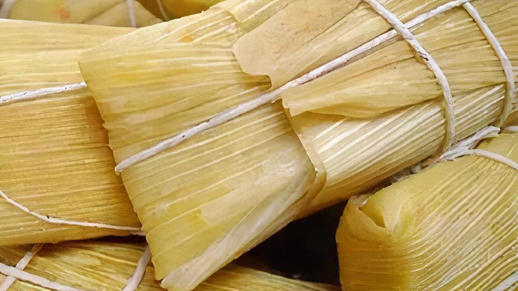 Tamal En Hoja · Dough wrapped around a filling and steamed in a corn husk or banana leaf.