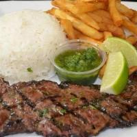 Churrasco · Juicy tender charbroiled skirt steak served with chimichurri sauce with a choice of 2 sides.
