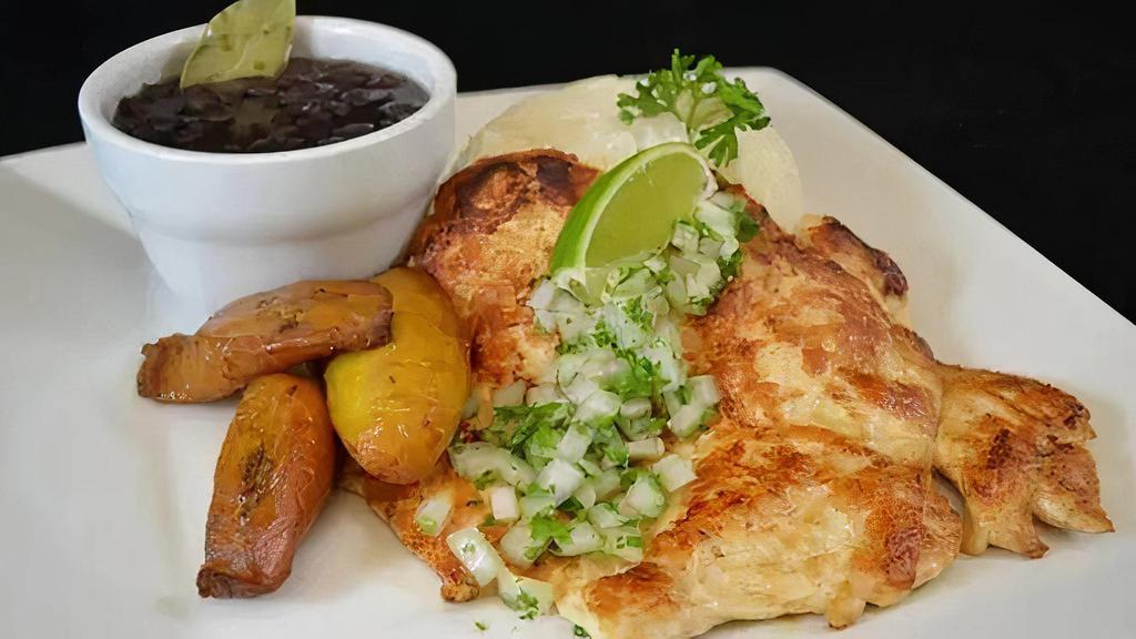 Bistec De Pollo · Boneless and skinless chicken breast grilled to order garnished with chopped onions and parsley.