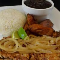 Chicken Vaca Frita · Flavorful shredded chicken grilled to perfection topped with sauteed onions.