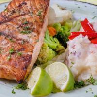 Fresh Atlantic Salmon · Grilled fresh Atlantic salmon with a side of cilantro aioli sauce.