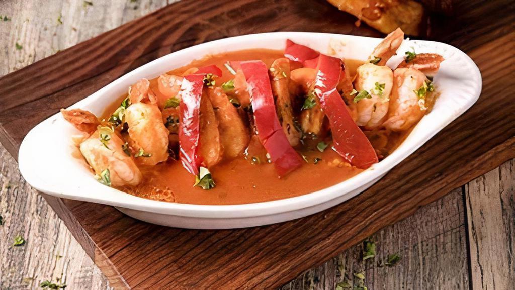 Camarones Enchilados · Creole shrimp with a tomato based sauce.