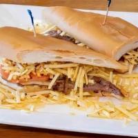 Pan Con Bistec · Our famous steak sandwich on toasted Cuban bread served with grilled with onions and garnish...