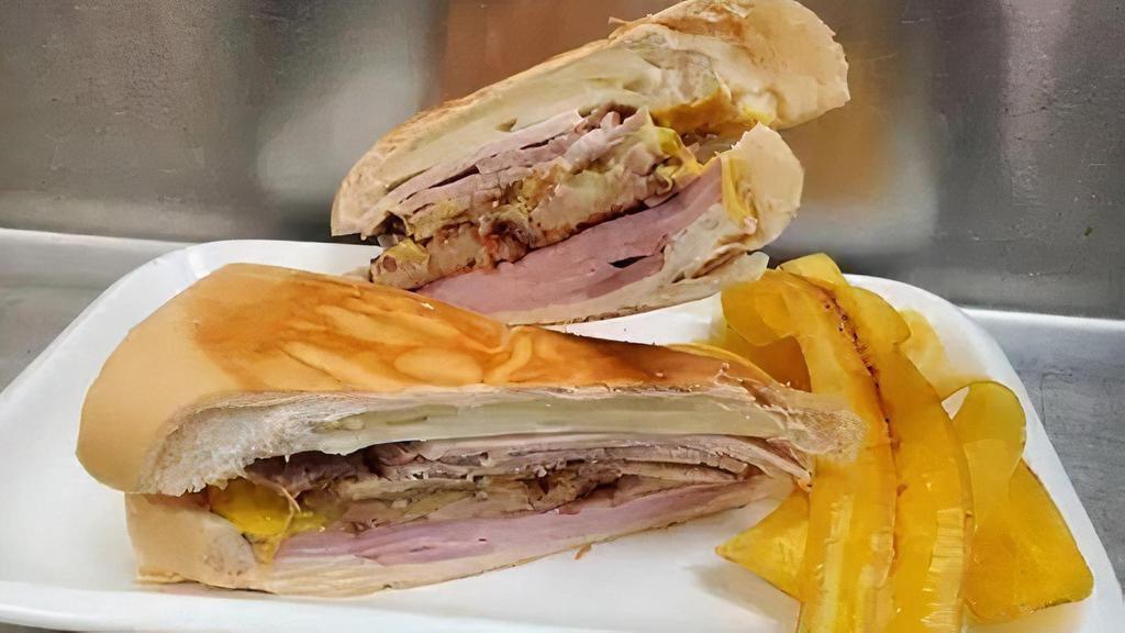 Croqueta Preparada · Ham, pork, swiss cheese, two croquettes and pickles with a splash of mustard on cuban bread served with Mariquitas.