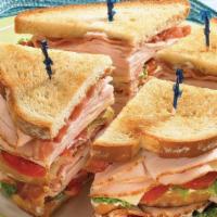 Club Sandwich · Ham, turkey, bacon, swiss cheese, lettuce and tomatoes with a touch of mayo on white toasted...