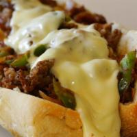 The Philly Cheese Steak Sub · Juicy chopped steak layered with melty Provolone cheese, grilled onions and peppers and topp...
