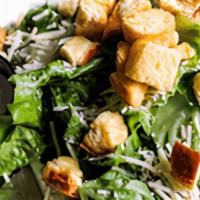 Caesar Salad · Fresh romaine with homemade eggless Caesar dressing. Topped with Asiago and croutons.