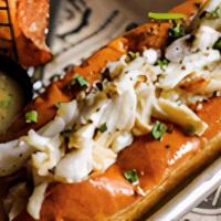 Crab Roll · Sauteed blue crab meat , chives, served with melted butter and homemade 404 sauce.Served wit...
