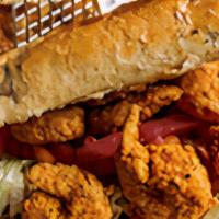 Shrimp Po Boy · Fried shrimp iceberg lettuce, diced tomatoes, pickled onions and a drizzle of homemade remou...