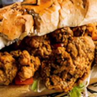 Oyster Po Boy · Fried Oysters, iceberg lettuce, diced tomatoes, pickled onion, and a drizzle of homemade Rem...
