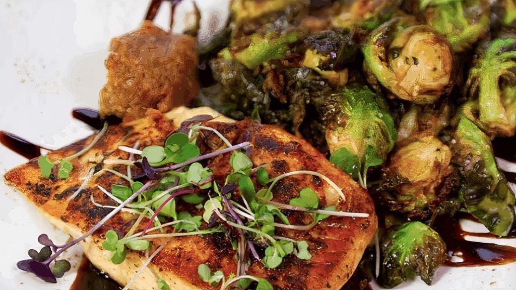 Salmon · Blackened salmon on a bed of brussels sprouts with our homemade bacon jam