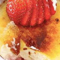 Crème Brûlée · Homemade creme brulee with seasonal berries and whipped cream