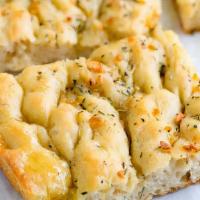 Focaccia Bread · Freshly baked focaccia bread with olive oil.