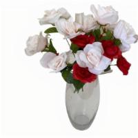 Mixed Rose Charmed - Silk · A mix of scented roses in a 8” inch bodies glass vases with rose petals. Include chocolates....